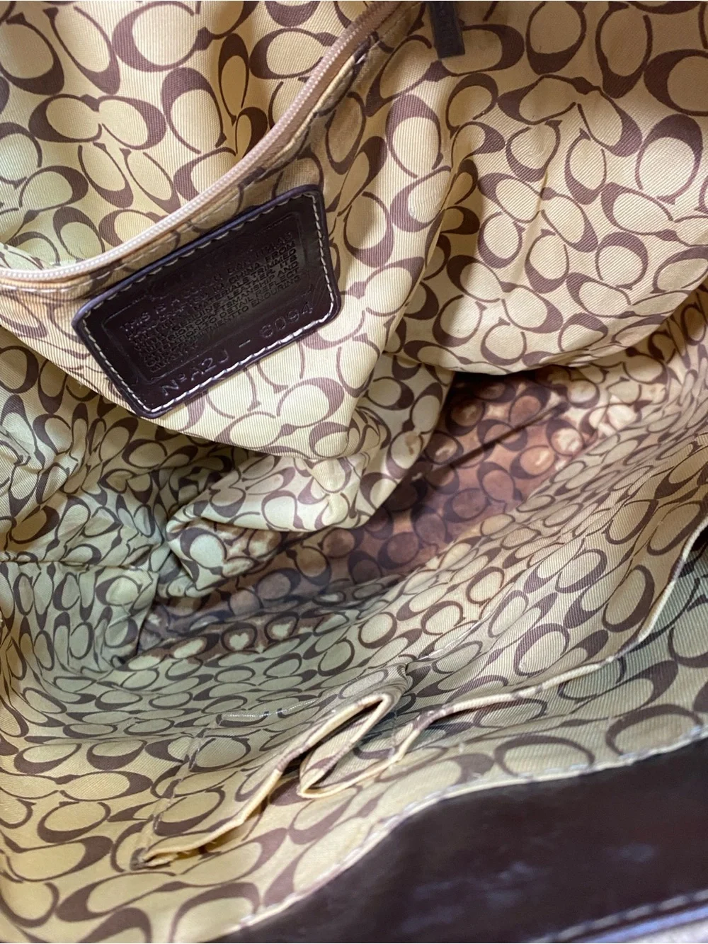 C Brown and Tan Signature Canvas Backpack